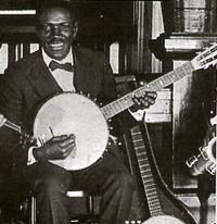 Johnny St. Cyr with a 6-string banjo he made himself.