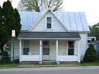 This house probably had asbestos siding when I was small.  It is one of the older houses in Donnelsville. Inside, it is laid out in an odd way, probably representing an addition or two. Click for bigger photo.